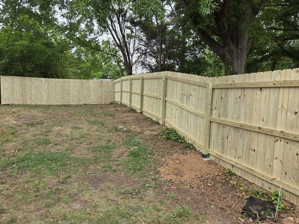 New wood privacy fence installation along backyard property line in Raleigh NC