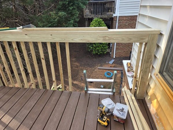 Work in progress! Combining durable composite decking with a sturdy new wood railing. Progress update on a custom backyard deck restoration in Raleigh, NC.