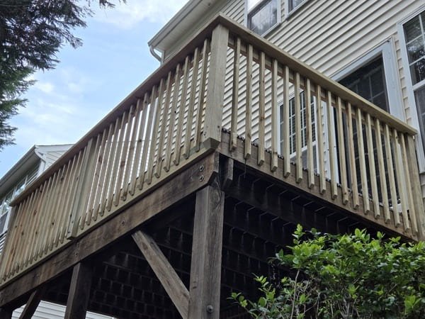 Wood railing replacement and structural wood deck repair by Innovation's Fence & Deck in Raleigh, NC