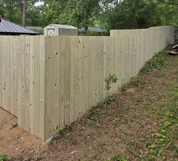 Professional wood fence builders installing residential privacy fencing in Raleigh NC